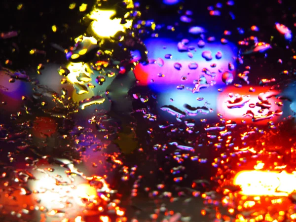 Verre de gouttes de pluie colorées — Photo