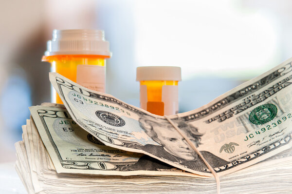 Medicine Bottles and Money