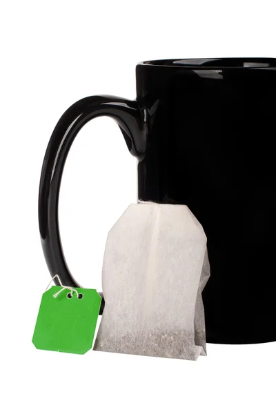 Gran taza negra y bolsa de té — Foto de Stock