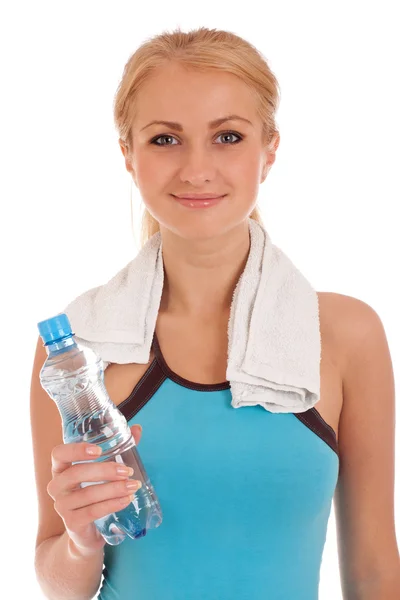 Happy fitness woman with bottle of water and towel — Stock Photo, Image