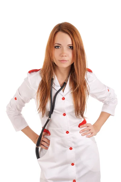 Angry young doctor with hands on hips — Stock Photo, Image