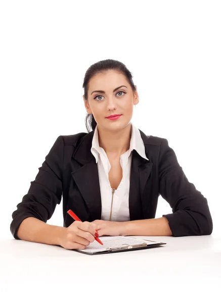 Portret firmy kobieta siedzi na jej biurku — Zdjęcie stockowe