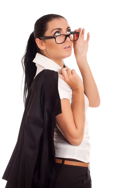 Portrait of young woman looking over glasses — Stock Photo, Image