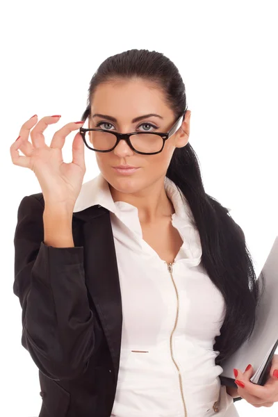 Portrait of young woman looking over glasses — Stock Photo, Image