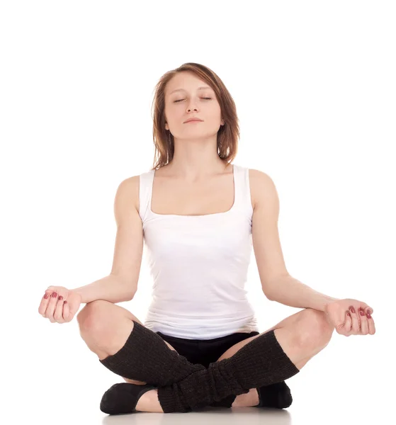 Young woman meditating in pose of lotus Stock Image