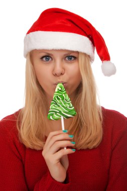 Genç sarışın kadın şeker ile Noel Baba şapkası