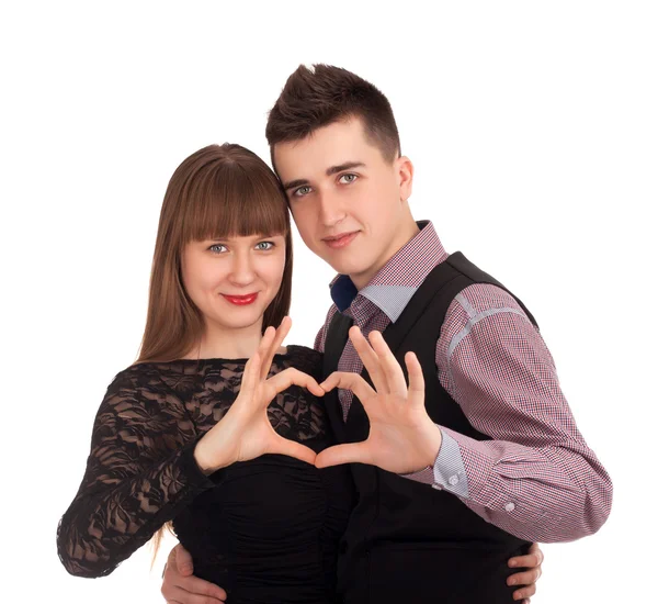 Happy couple showing heart with their fingers — Stock Photo, Image