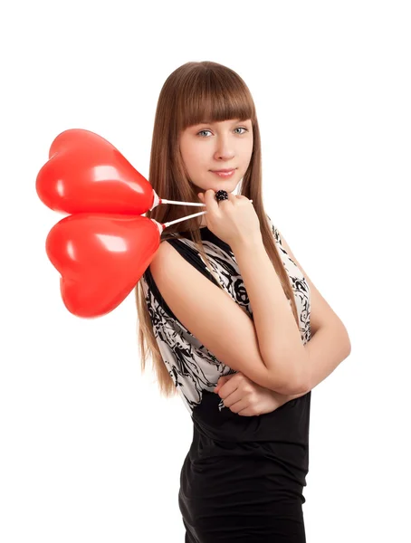 Jeune femme avec des ballons en forme de coeur — Photo