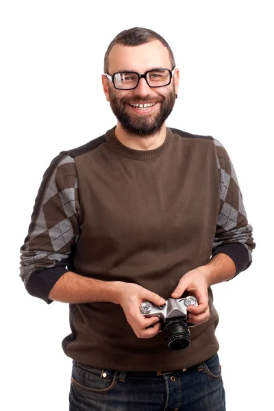 Młody człowiek z brodą, trzymając aparat fotograficzny — Zdjęcie stockowe