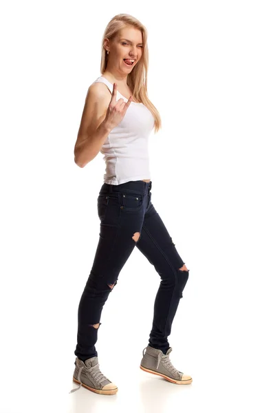 Portrait of blond teenage gesturing rock on — Stock Photo, Image