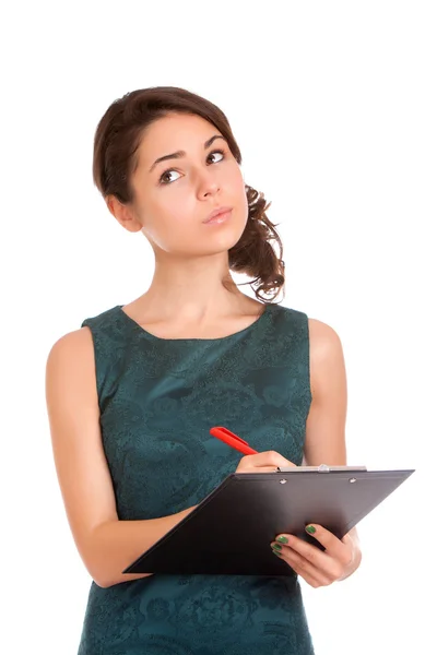 Young woman holding clipboard and thinking — Stock Photo, Image