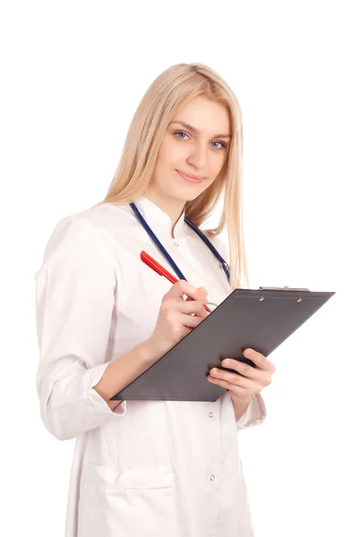 Joven doctor escribiendo en portapapeles — Foto de Stock