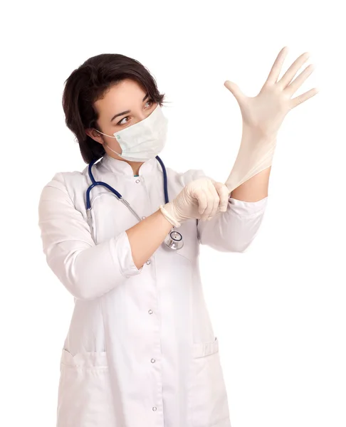 Arzt zieht Handschuhe an — Stockfoto