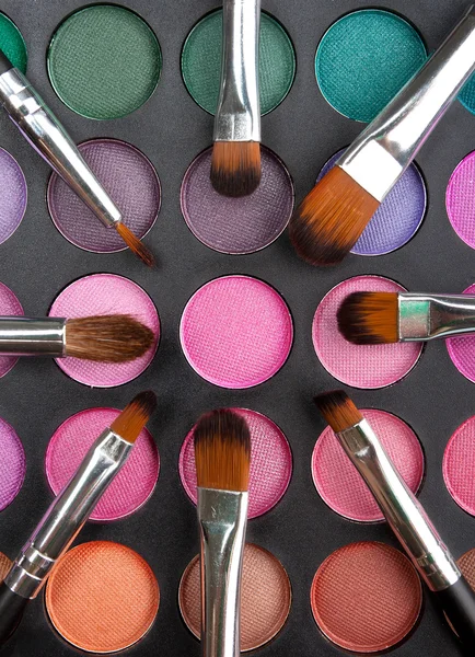 Makeup brushes and shadows — Stock Photo, Image