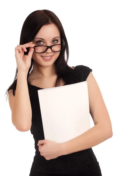 Young woman holding womens magazine — Stock Photo, Image