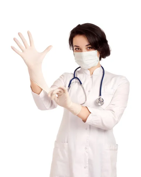 Doctor putting on gloves — Stock Photo, Image