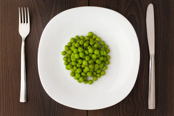 Peas on a plate — Stock Photo, Image