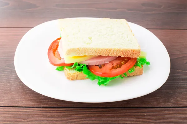 Sandwich with ham, cheese and tomato — Stock Photo, Image