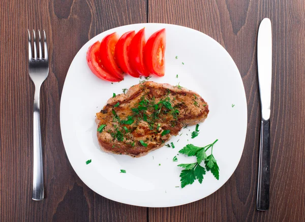 Grilled steak on white plate — Stock Photo, Image