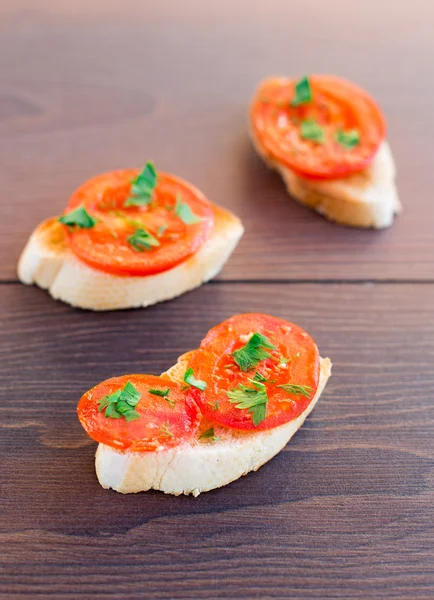 Delicious tomato bruschetta with herbs — Stock Photo, Image