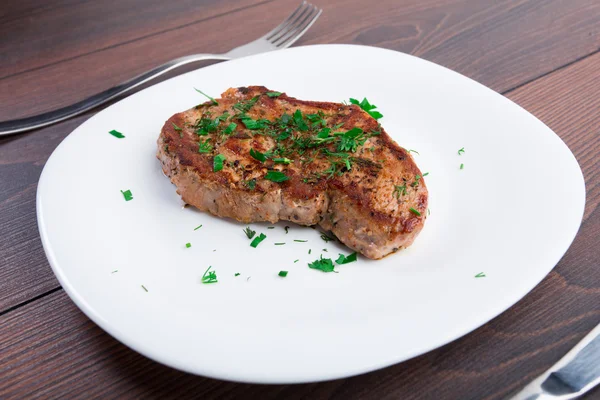 Grilled steak on white plate — Stock Photo, Image