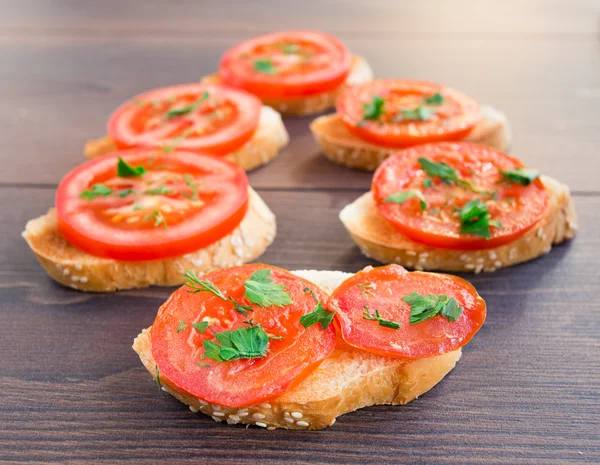 Delicious tomato bruschetta with herbs — Stock Photo, Image