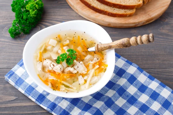 Bowl of chicken soup with vegetables and noodles — Stock Photo, Image