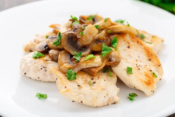 Fried chicken fillet with mushrooms — Stock Photo, Image