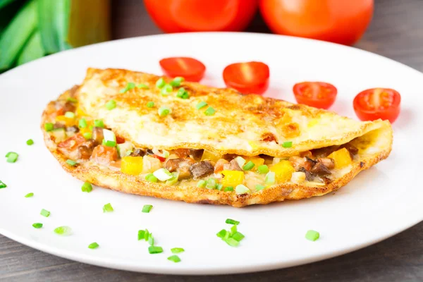 Omelet with diced vegetables — Stock Photo, Image