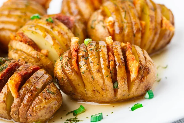 Accordion baked potatoes with bacon — Stock Photo, Image