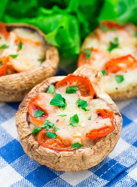Mushrooms stuffed with mozzarella and tomato — Stock Photo, Image