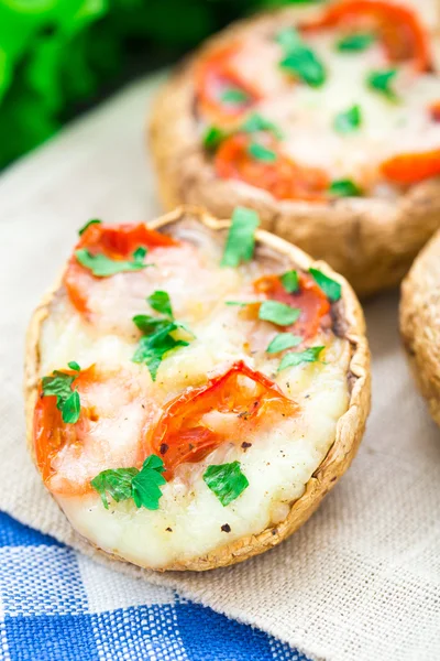 Mushrooms stuffed with mozzarella and tomato — Stock Photo, Image