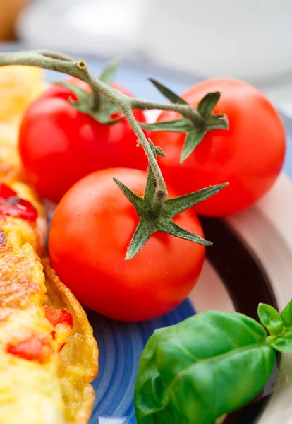 Cherry tomato on a plete — Stock Photo, Image