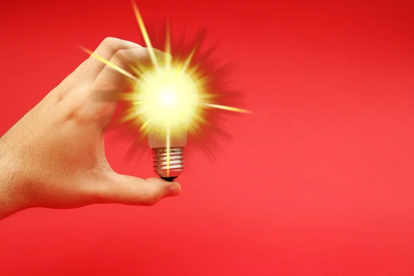 Background with lit lightbulb — Stock Photo, Image