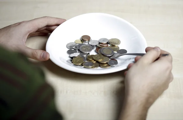 Eating some coins — Stock Photo, Image