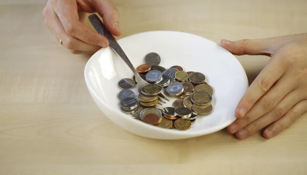 Eating some coins — Stock Photo, Image