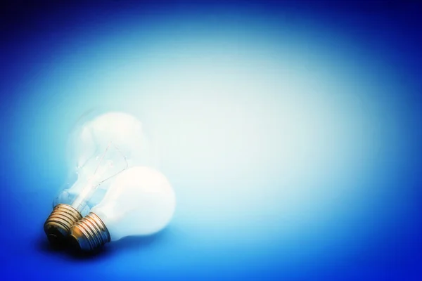 Background with lit lightbulb — Stock Photo, Image