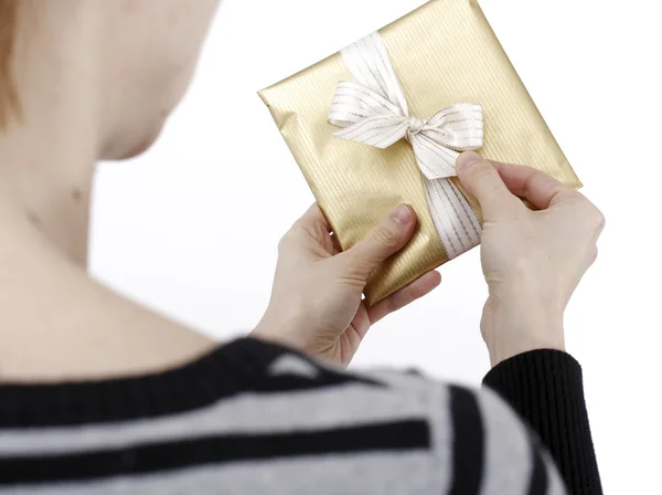 Young woman holding a present — Stock Photo, Image