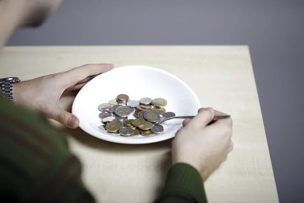 Eating some coins — Stock Photo, Image