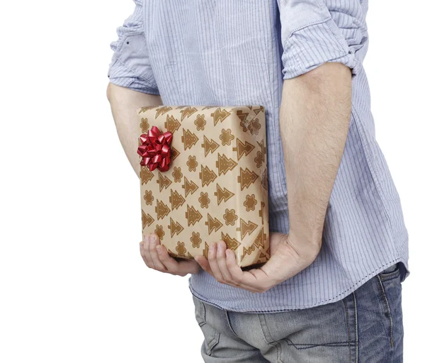 Young man holding a present — Stok fotoğraf