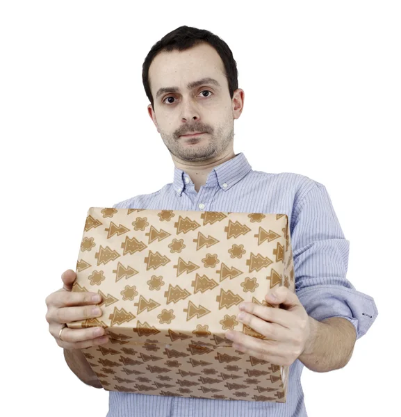 Young man holding a present — Stock Photo, Image