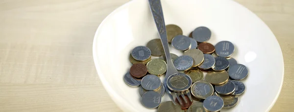 Eating some coins — Stock Photo, Image