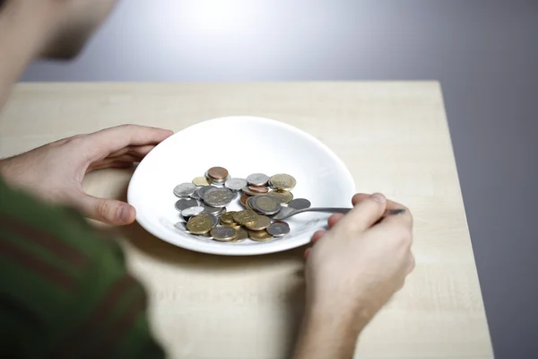 Eating some coins — Stock Photo, Image