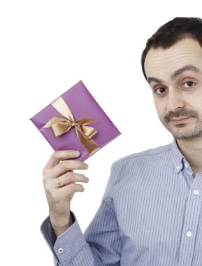Young man holding a present