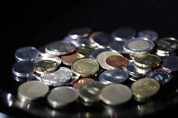Coins on black — Stock Photo, Image