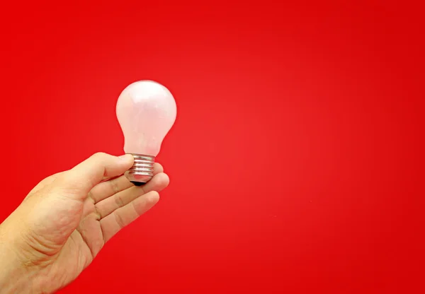 Background with lit lightbulb — Stock Photo, Image