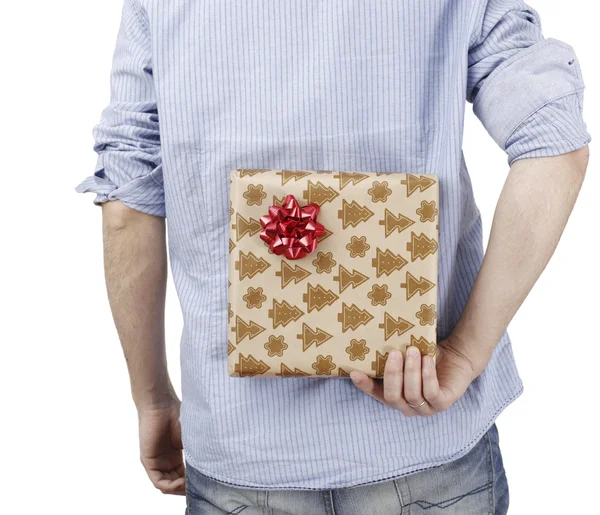 Young man holding a present — Stok fotoğraf