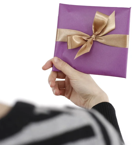 Young woman holding a present — Stock Photo, Image