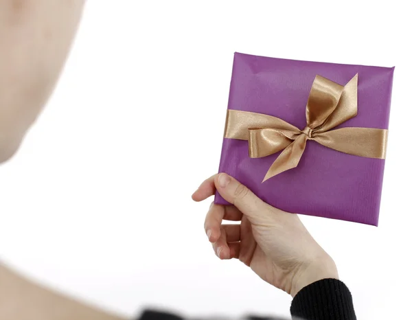 Young woman holding a present — Stock Photo, Image