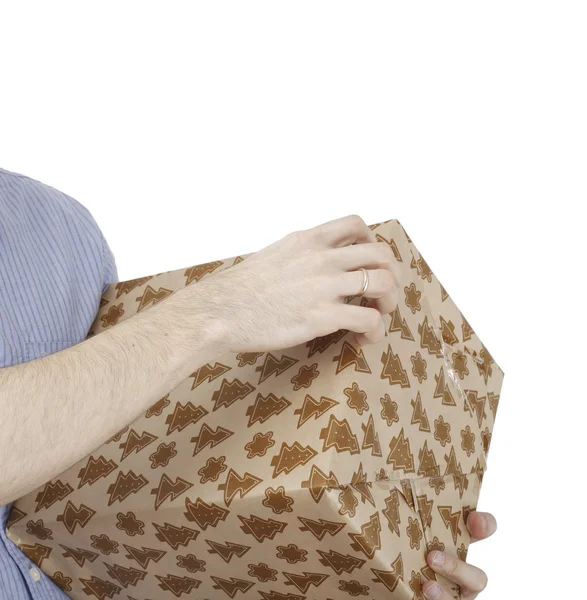 Young man holding a present — Stock Photo, Image